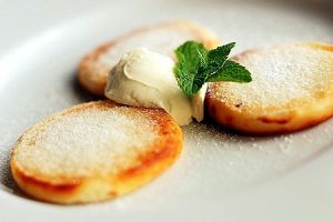 Delicate cottage cheese pancakes made in Tsarivka restaurant photo